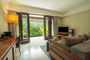 Suite, 1 Bedroom, Garden View | Living area | 42-inch LED TV with satellite channels, TV