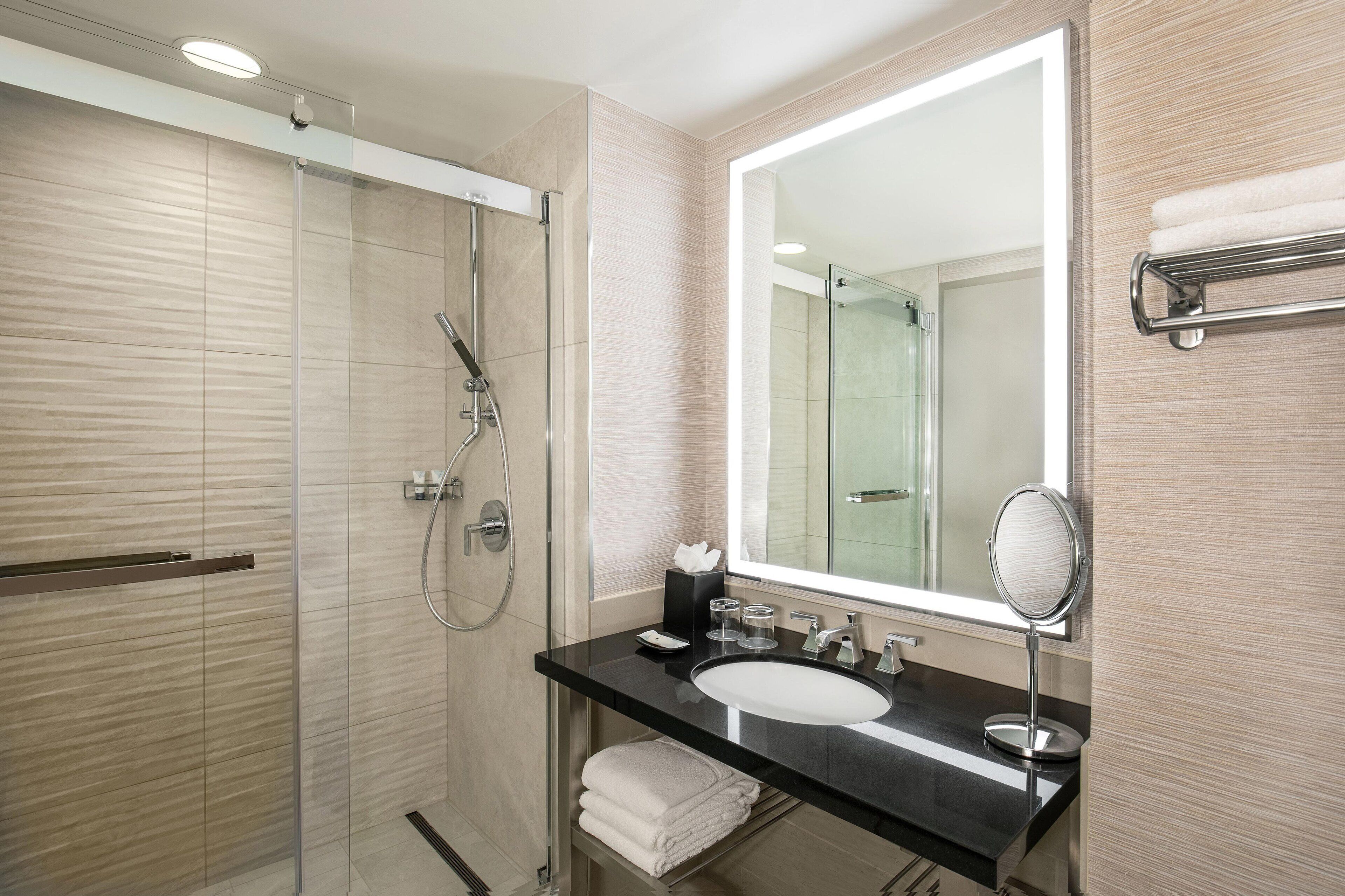 combined shower/bathtub, rainfall showerhead, designer toiletries