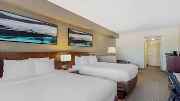 Suite, 2 Queen Beds & Sofa Bed, Non-Smoking | Down comforters, desk, laptop workspace, blackout drapes