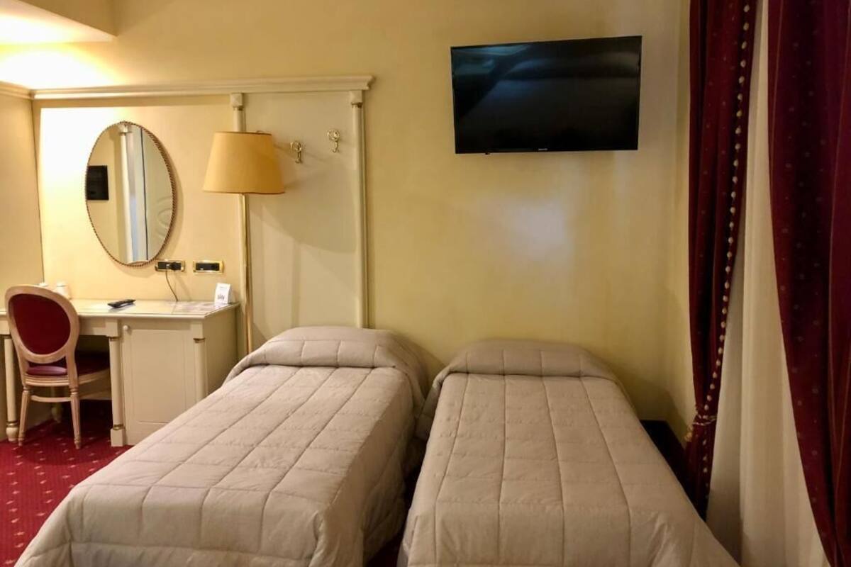 Classic Quadruple Room | Hypo-allergenic bedding, minibar, in-room safe, desk