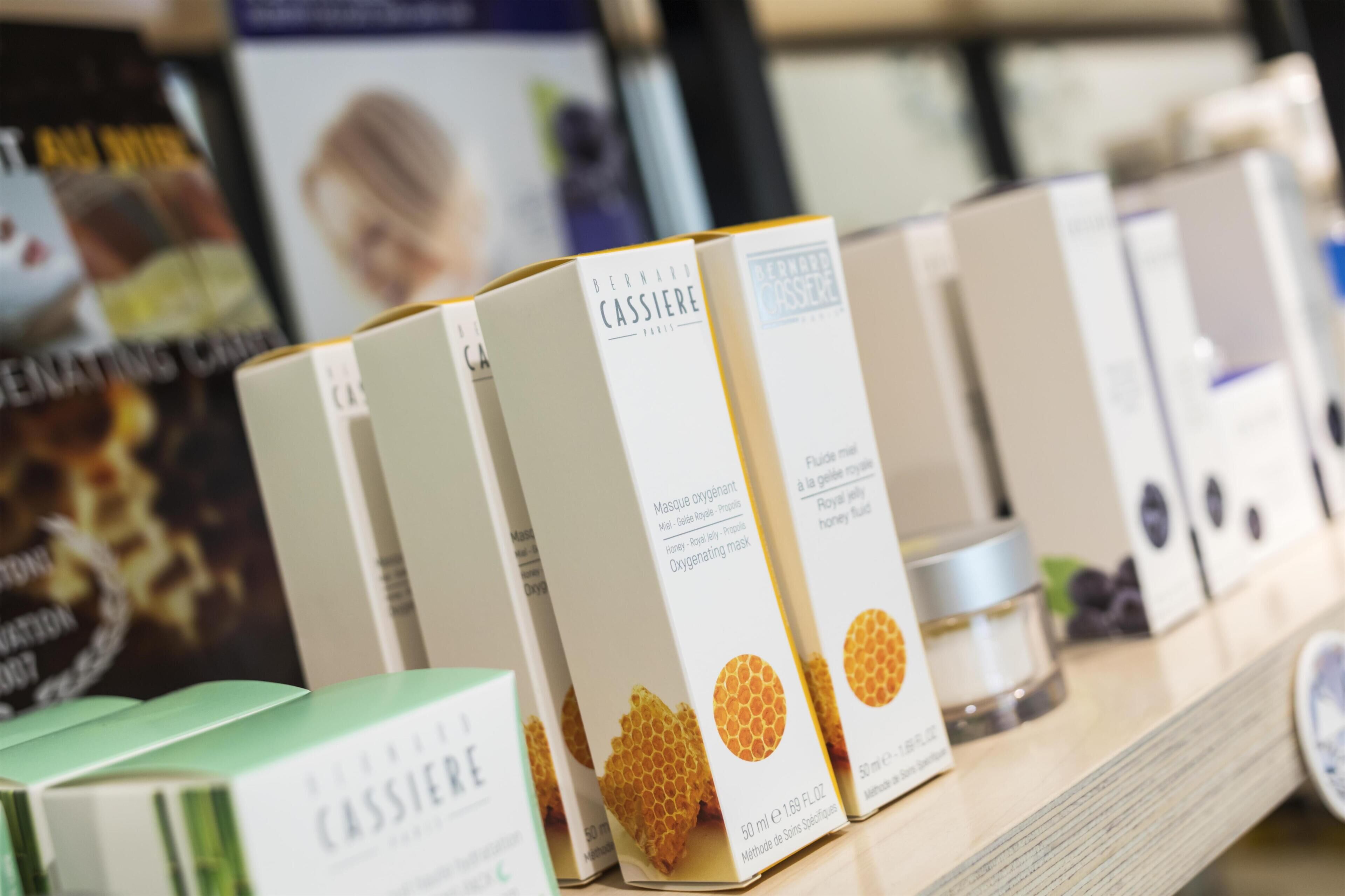 A display of skincare products with visible brand names and product types.