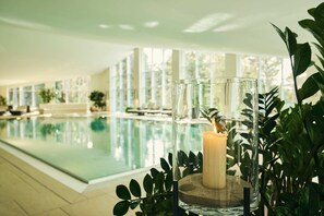 Indoor pool, open 7:00 AM to 9:00 PM, pool loungers