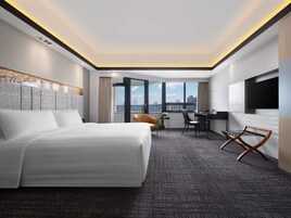 Deluxe Room, 1 King Bed, City View | Premium bedding, minibar, in-room safe, individually decorated