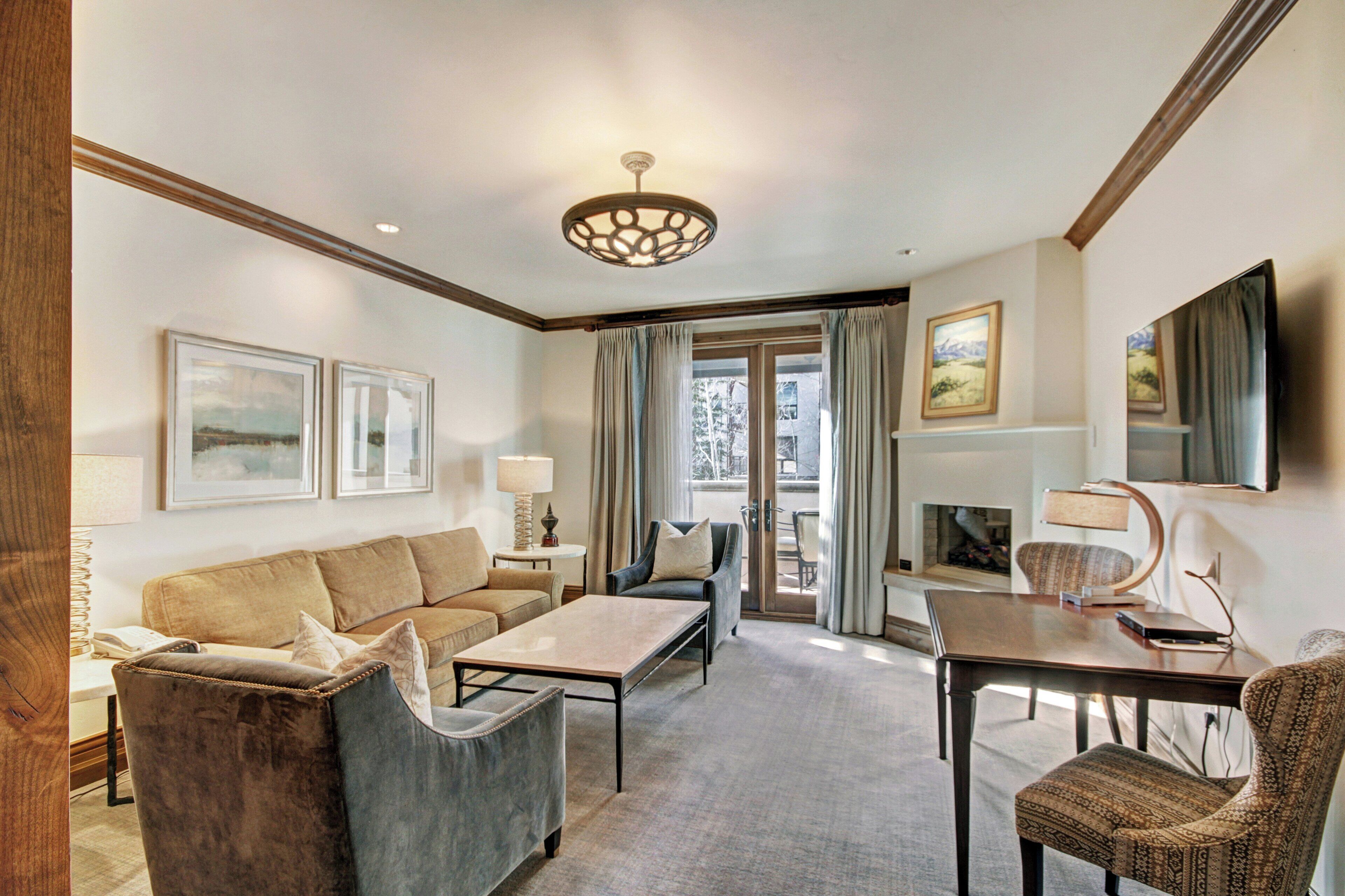 Junior Suite | Living area | 42-inch flat-screen TV with satellite channels, TV, fireplace