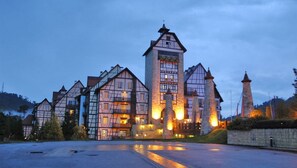 A traditional European-style building with multiple towers and a prominent central tower. - Colmar Tropicale (Bukit Tinggi)