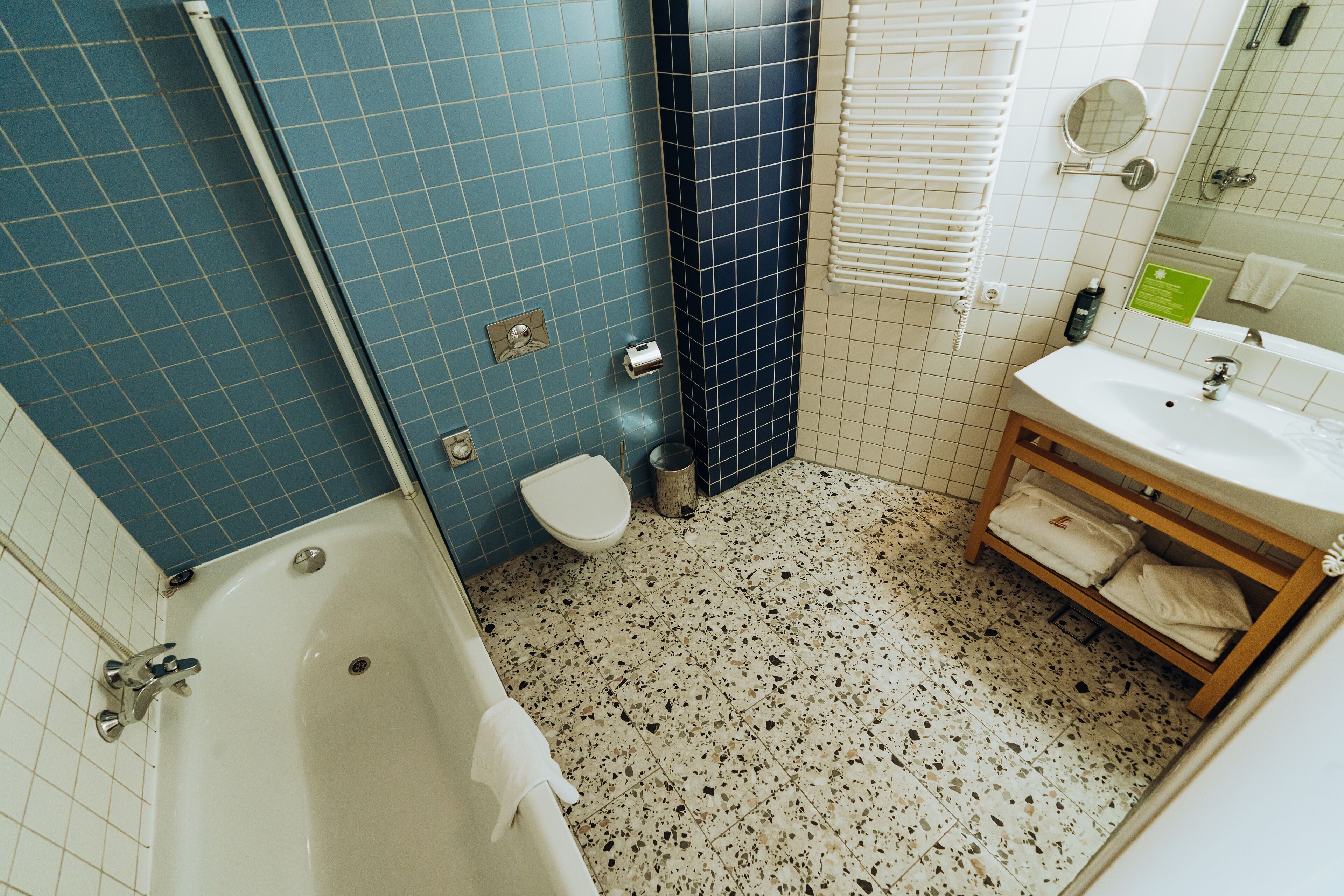 A bathroom with a bathtub, toilet, and sink.