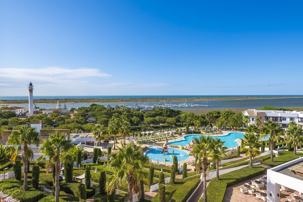 Indoor pool, outdoor pool, pool umbrellas, sun loungers