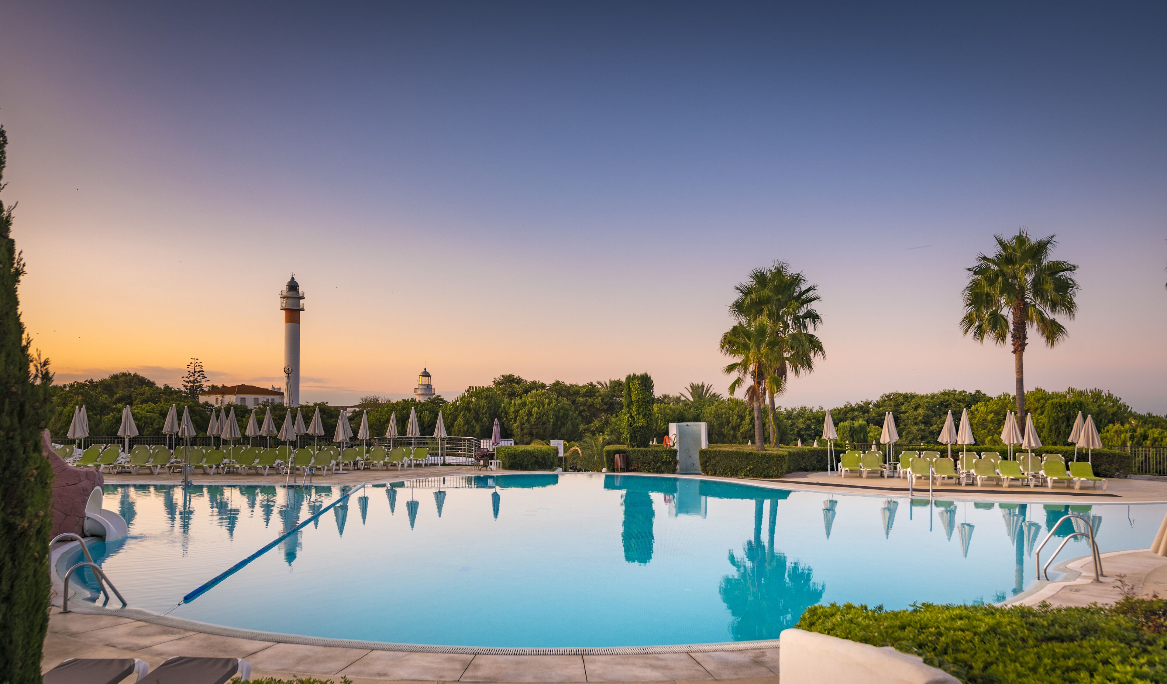 indoor pool, outdoor pool, pool umbrellas, pool loungers