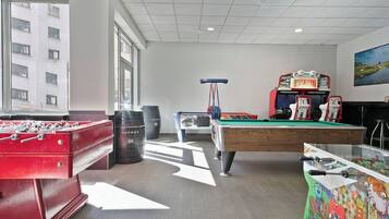 Relax and have fun in our recreational area, featuring a foosball table, pool table, and table tennis table.