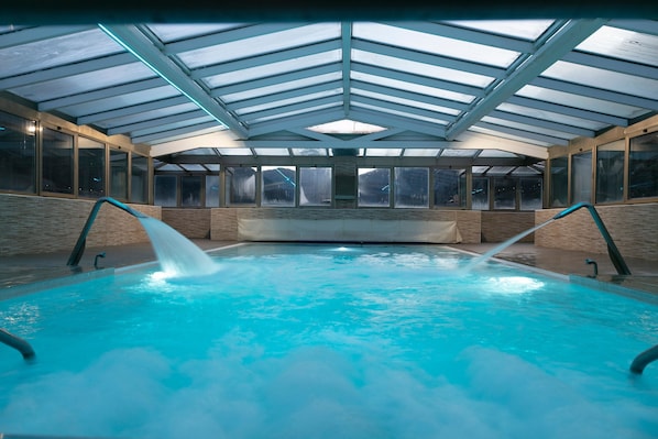 Indoor pool, open 11:00 AM to 8:00 PM, pool loungers