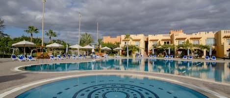 Outdoor pool, open 10:00 AM to 5:00 PM, pool umbrellas, sun loungers