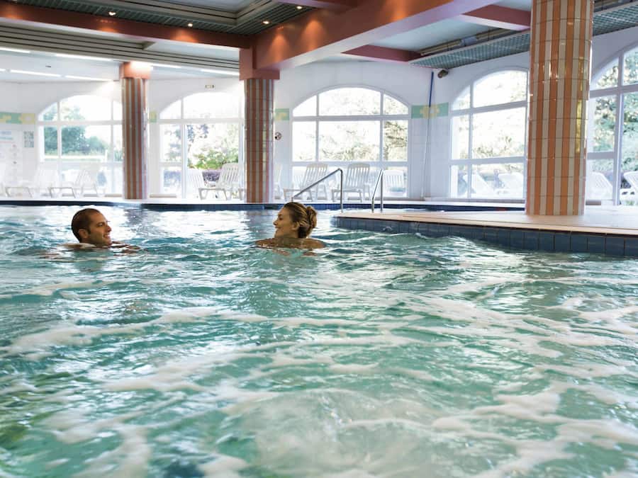 Indoor pool, open 8:30 AM to 7:30 PM, pool loungers