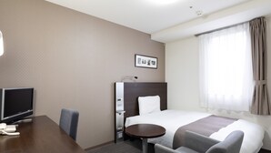 A hotel room with a bed, a desk with a TV, a chair, a small table, and a window with curtains. - Comfort Hotel Sendai West (Sendai)