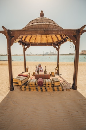 On the beach, sun loungers, beach umbrellas, beach towels