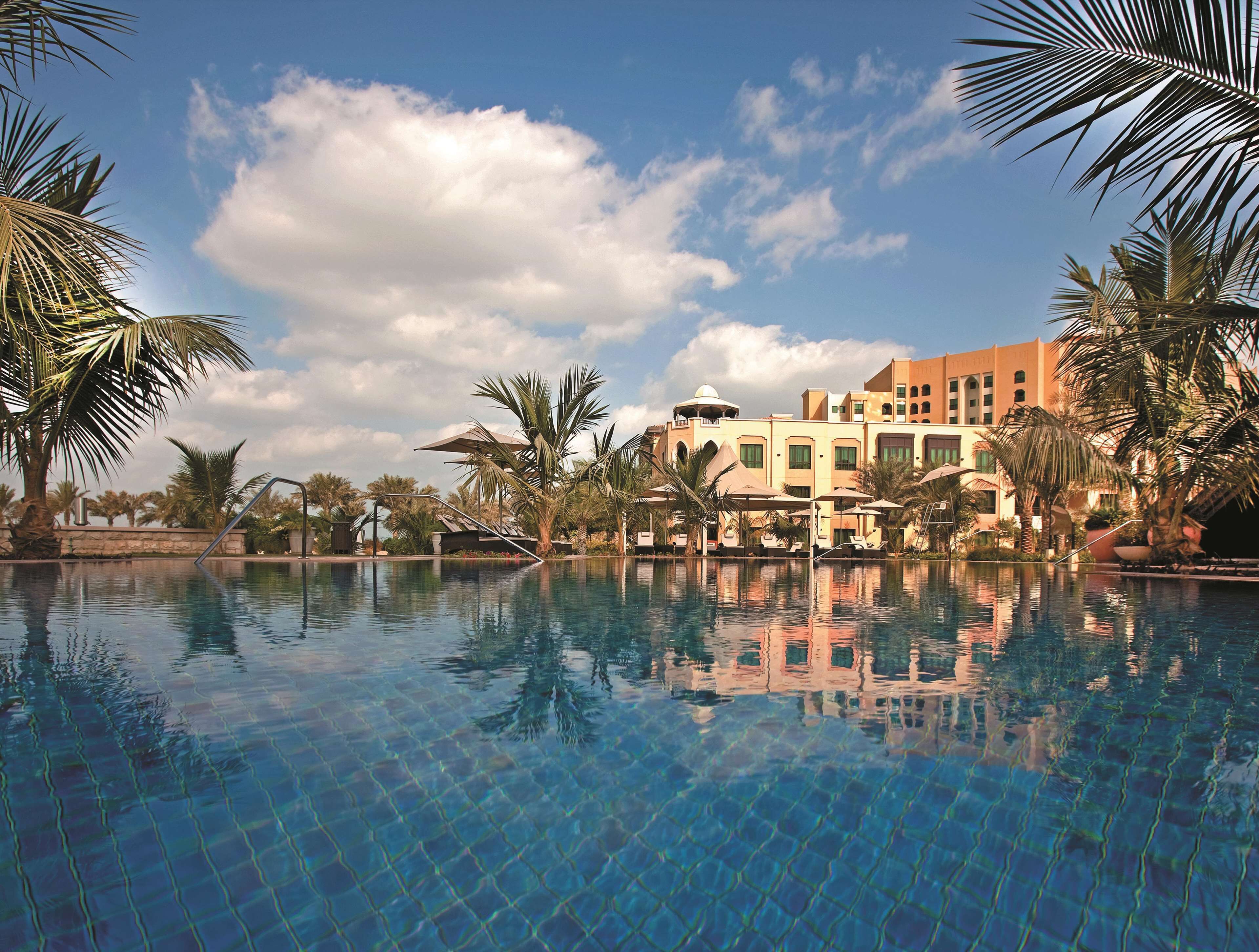 4 outdoor pools, open 6:00 AM to 8:00 PM, pool umbrellas, pool loungers