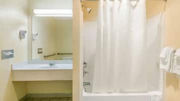 A bathroom with a sink, mirror, and shower curtain.