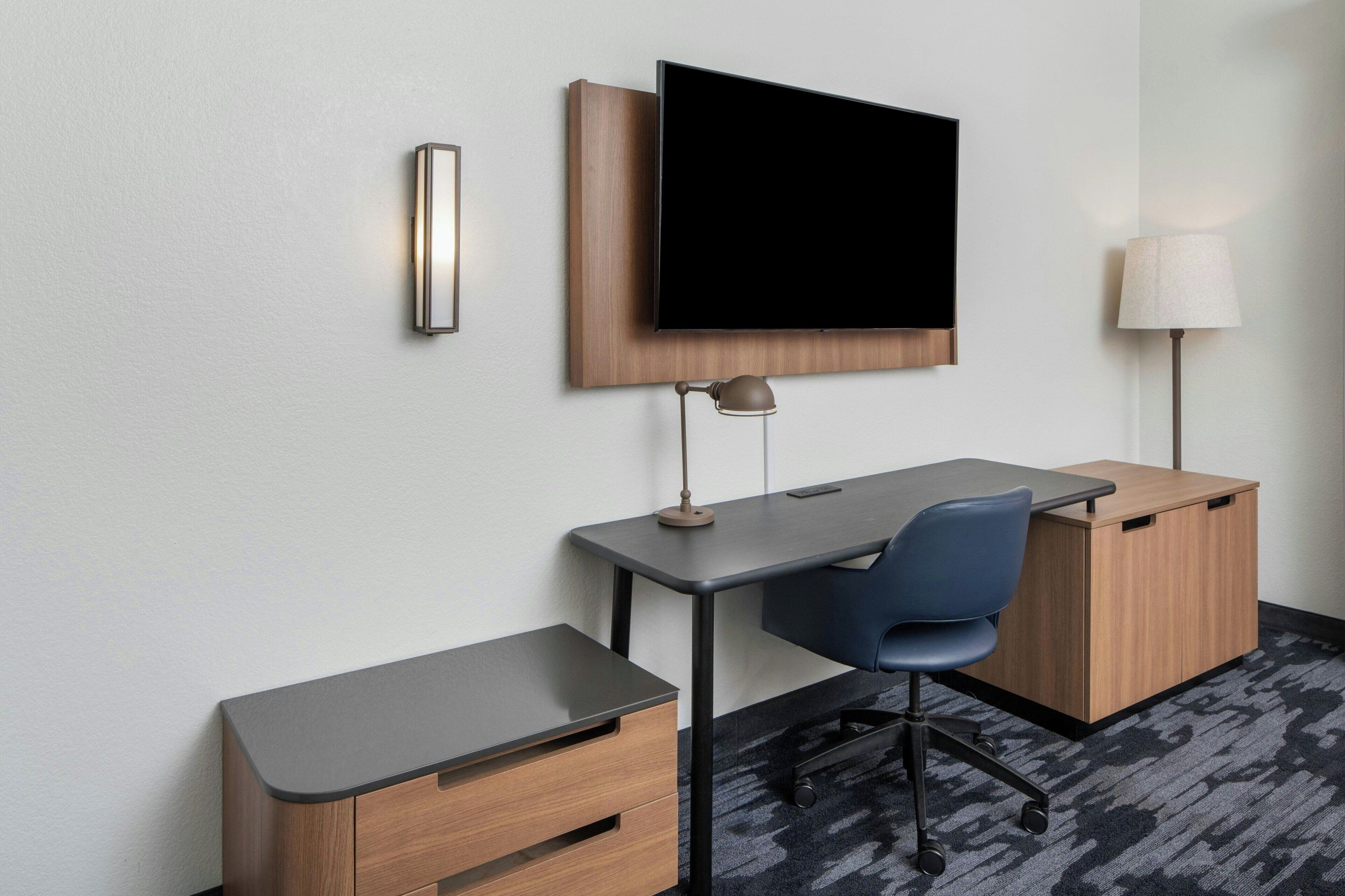 hypo-allergenic bedding, desk, laptop workspace, blackout curtains