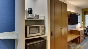 A compact kitchenette with a microwave, coffee maker, and refrigerator. - Holiday Inn Express Fishkill-Mid Hudson Valley by IHG (Fishkill)
