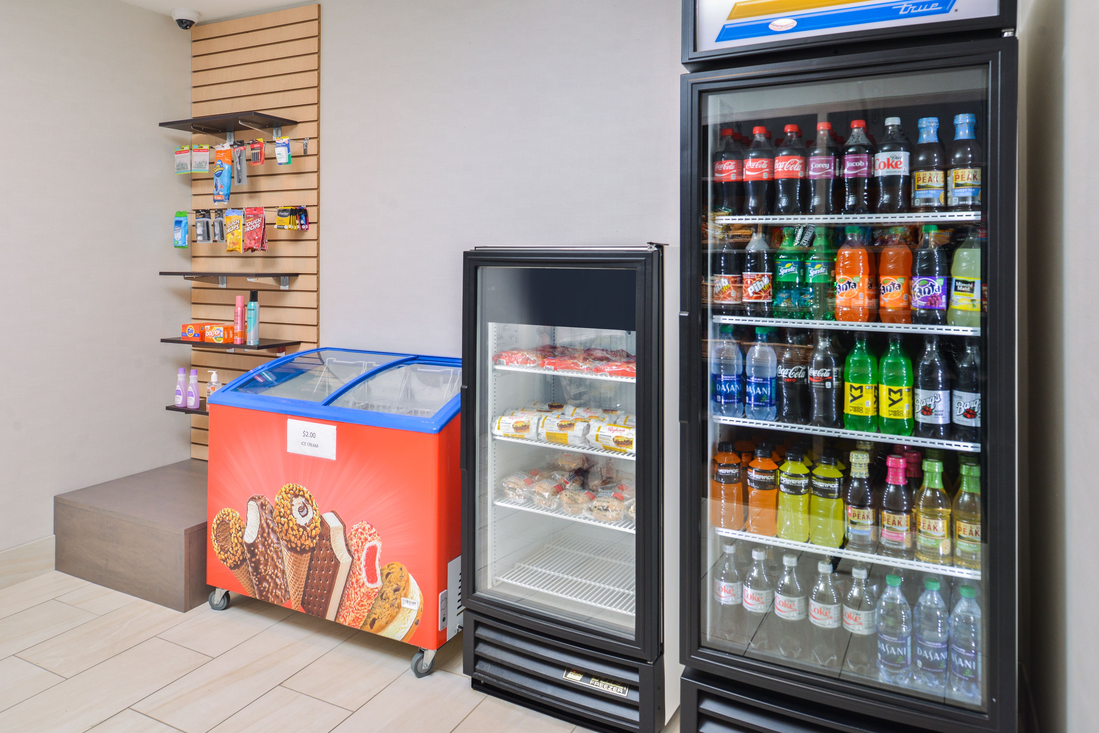 A vending machine with snacks and a refrigerator stocked with beverages.