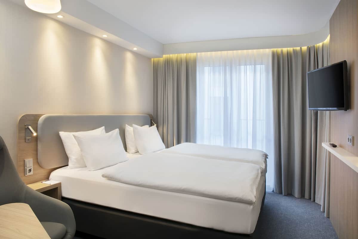 Premium bedding, in-room safe, desk, soundproofing