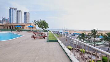 Relax by the pool and enjoy the tranquil views of the surrounding landscape.