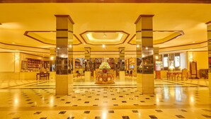 A spacious lobby with a central fountain, high ceilings, and a polished floor. - Galadari Hotel (Colombo)