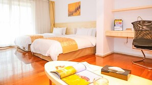 A hotel room with two beds, a desk with a chair, a window with curtains, and a painting on the wall. - Eastern Garden Service Apartment (Shanghai)
