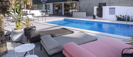 Seasonal outdoor pool, pool loungers