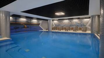 Indoor pool, open 7:00 AM to 10:30 PM, pool loungers
