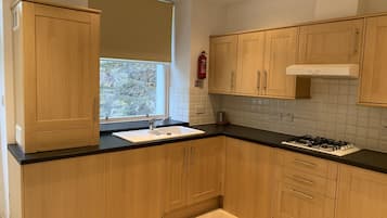 Departamento, 2 habitaciones | Cocina privada | Cafetera y tetera y tetera eléctrica