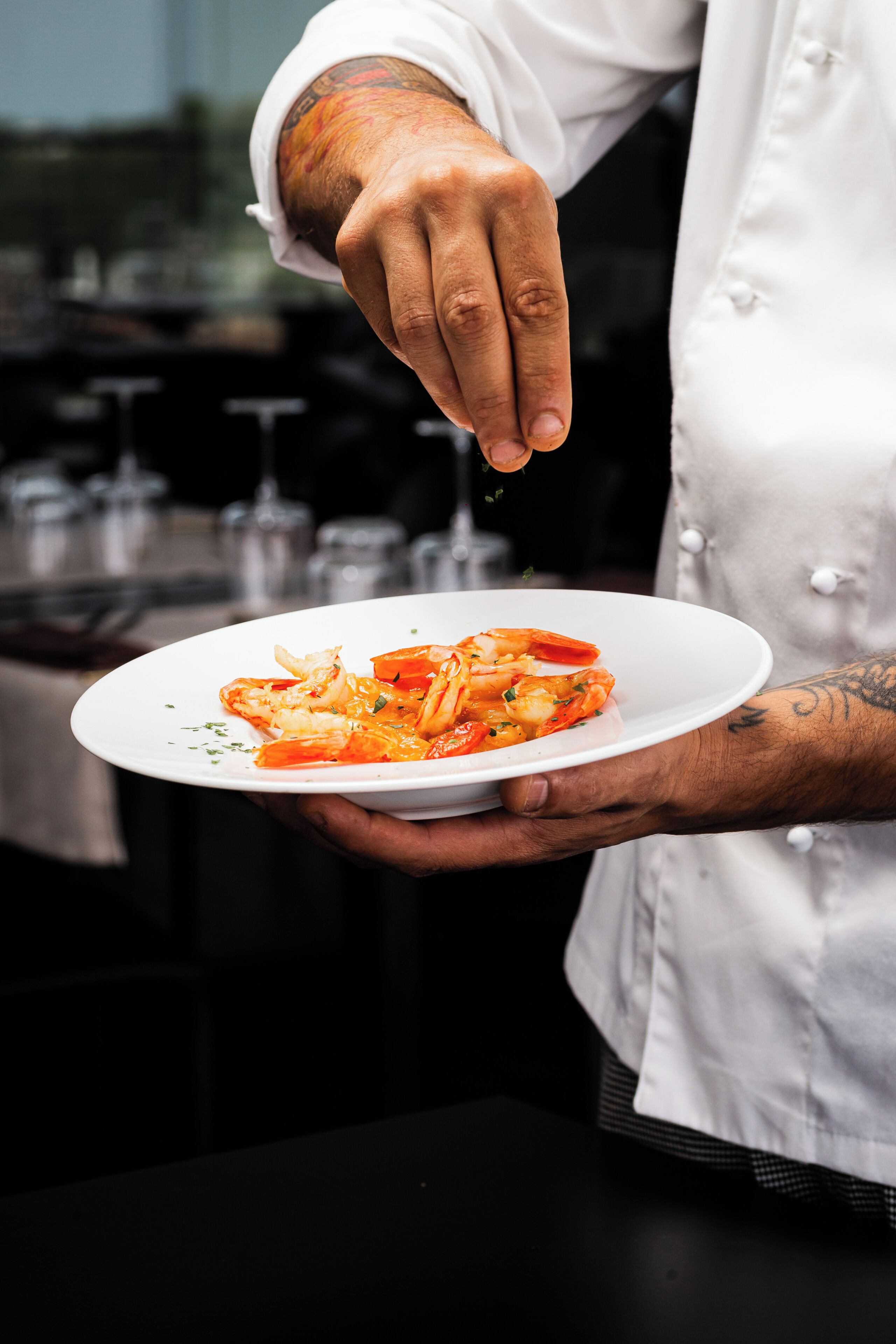 A person holding a plate of food.