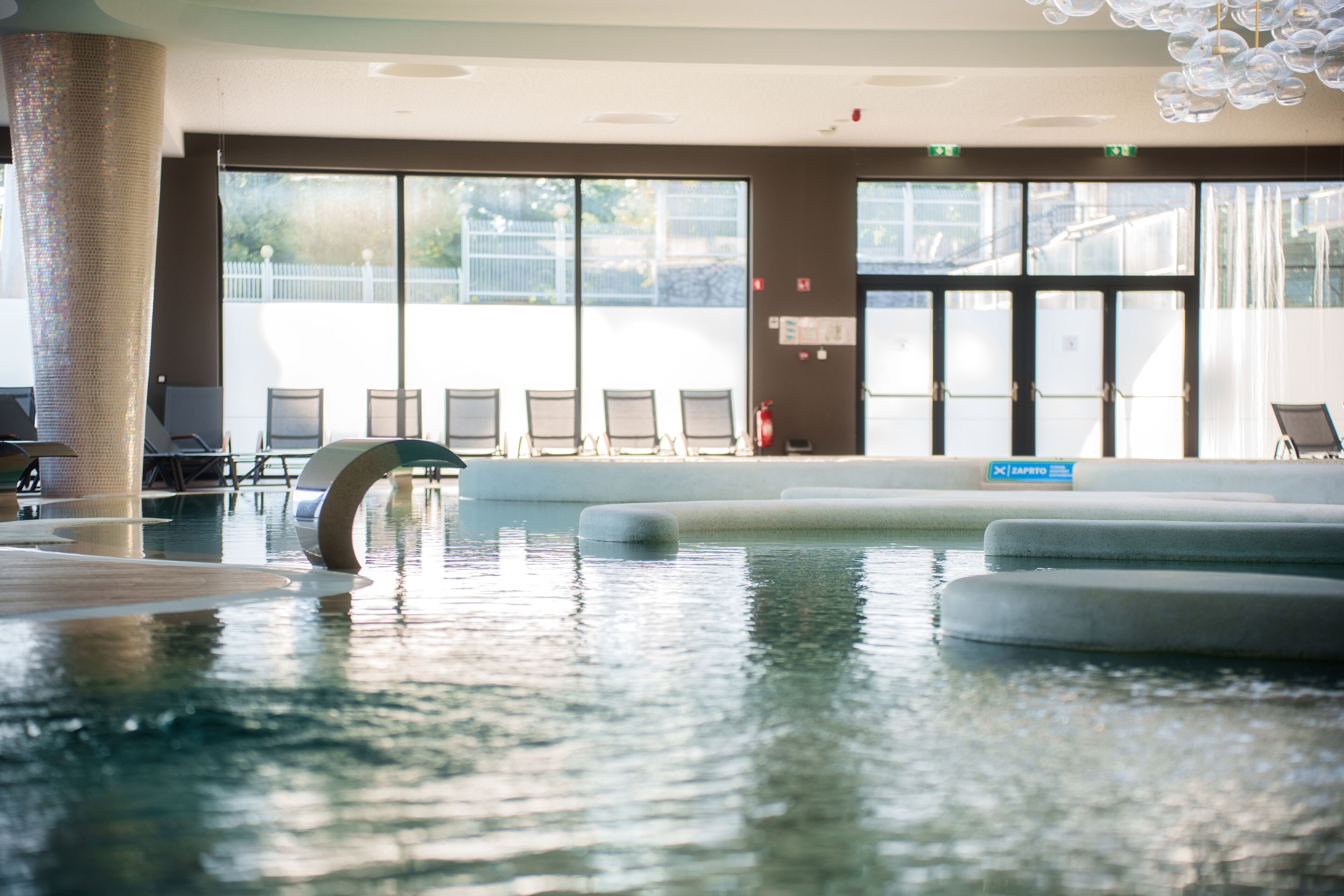 indoor pool, open 2:00 pm to 8:00 pm, pool loungers, lifeguards on site