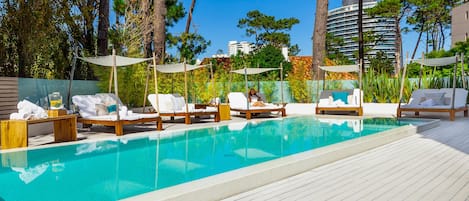 Indoor pool, outdoor pool, pool umbrellas, sun loungers