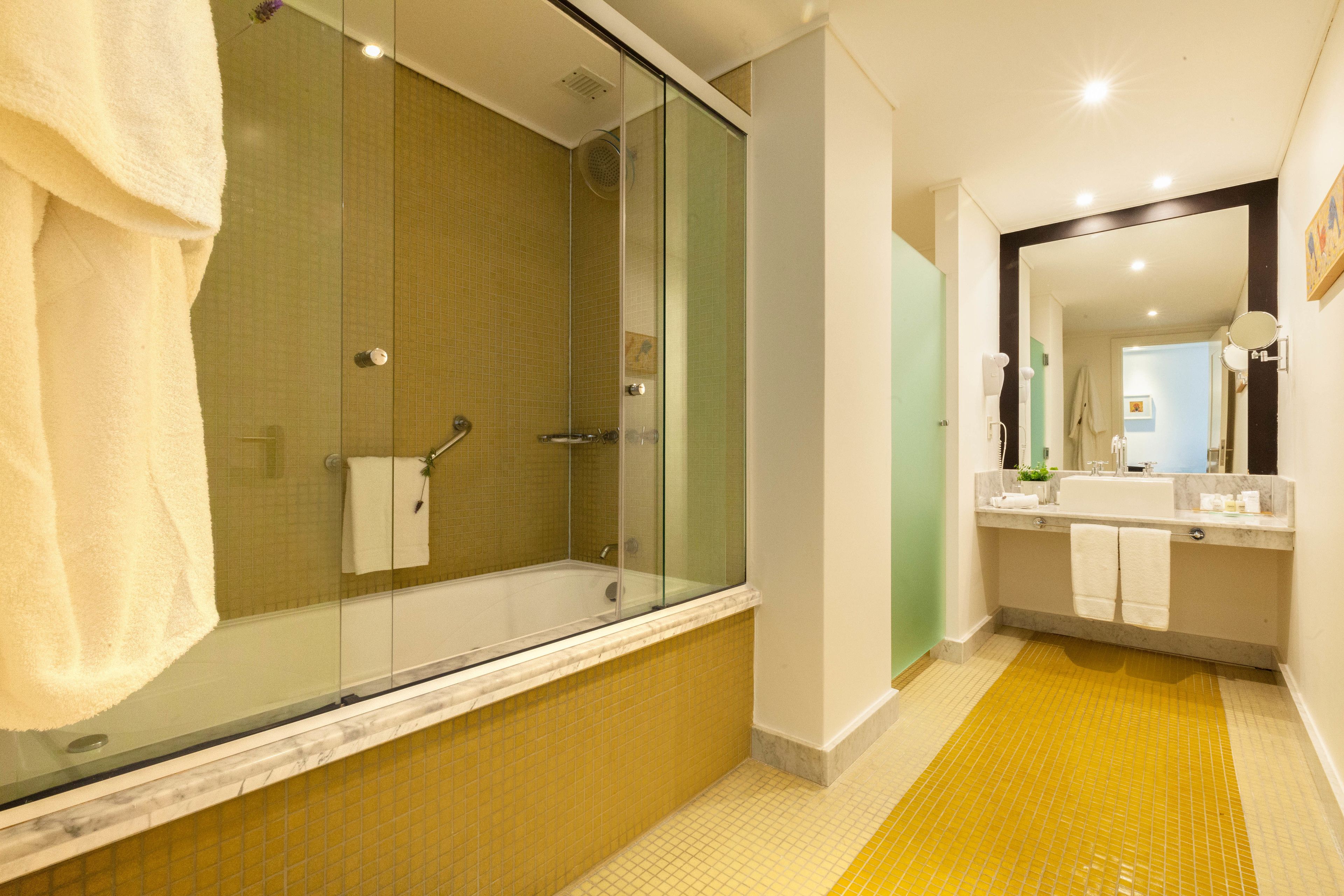 deluxe suite | bathroom | designer toiletries, hair dryer, bidet, towels