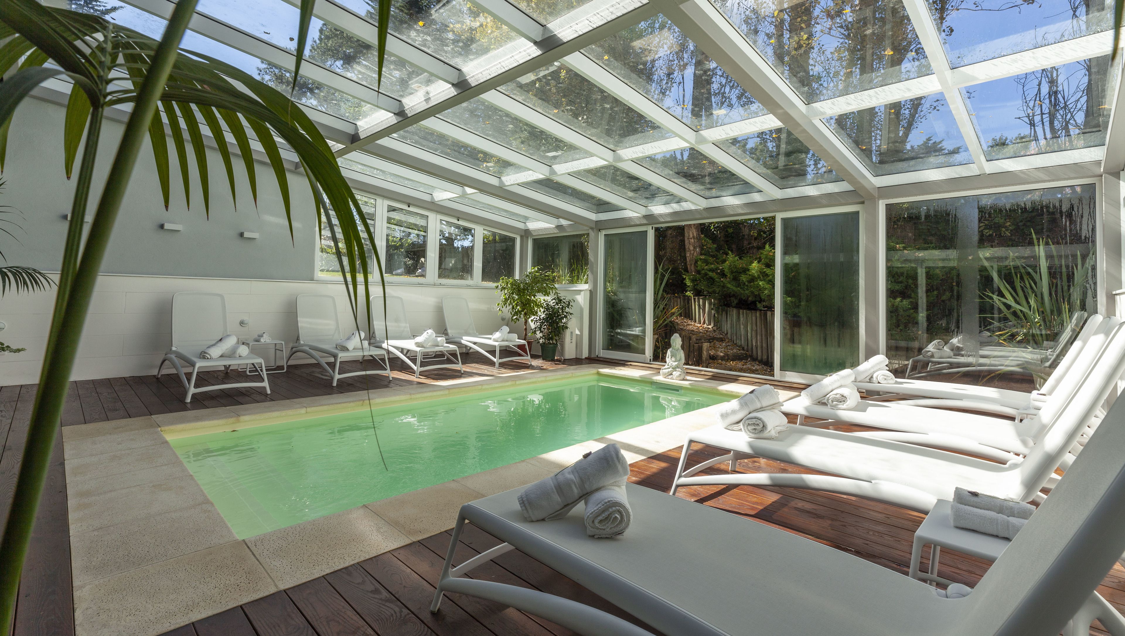 indoor pool, outdoor pool, pool umbrellas, pool loungers