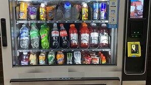 A vending machine with various snacks and drinks.