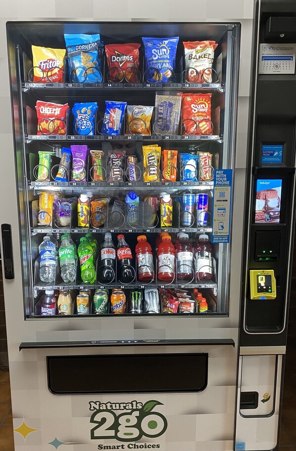 A vending machine with various snacks and drinks.