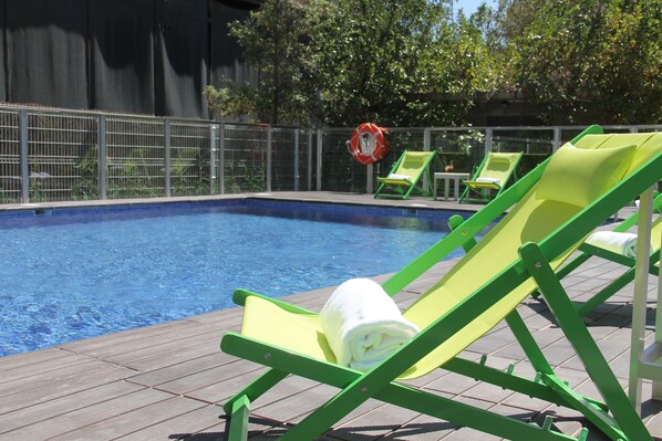 2 outdoor pools, open 10:00 AM to 9:00 PM, pool loungers