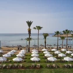 On the beach, sun-loungers, beach umbrellas, beach towels