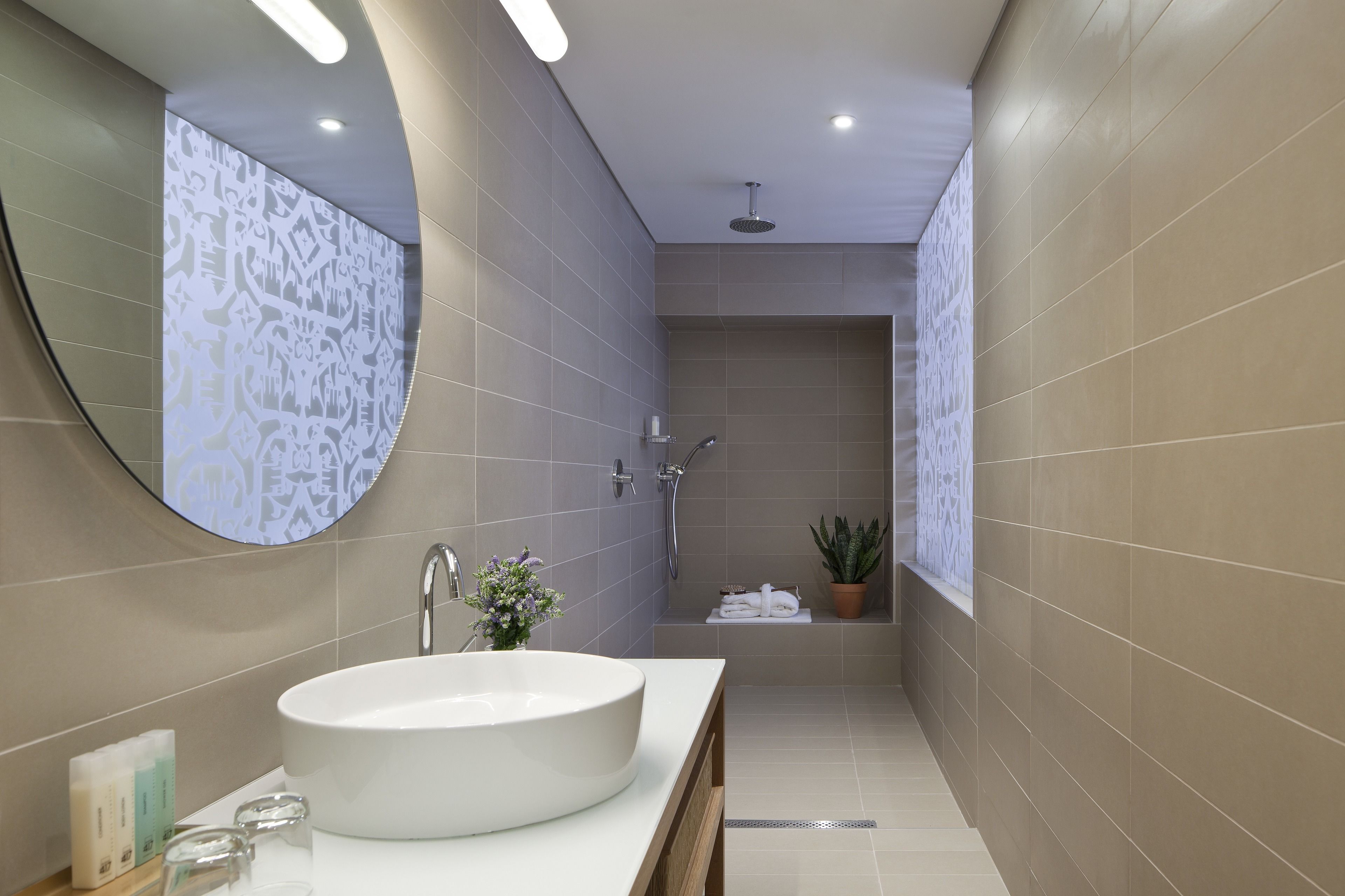 superior room | bathroom | rainfall showerhead, designer toiletries, hair dryer, towels