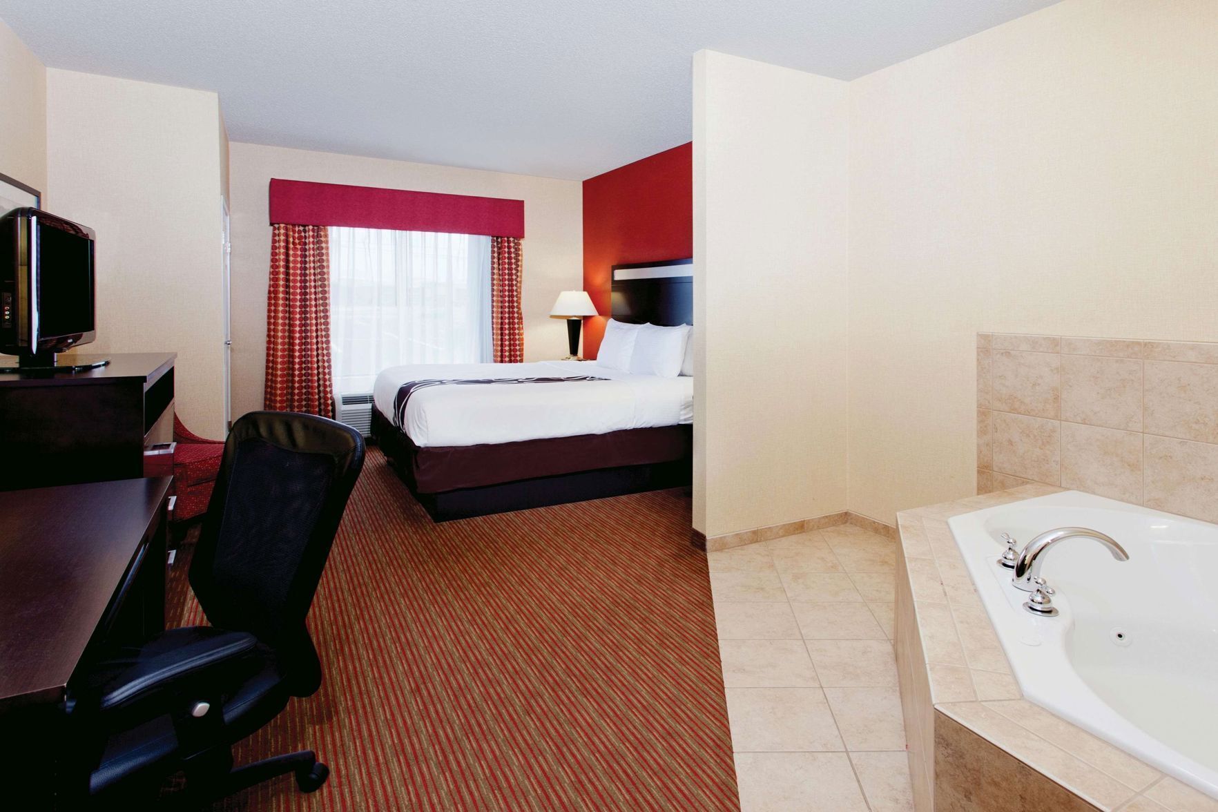 Premium bedding, desk, laptop workspace, iron/ironing board