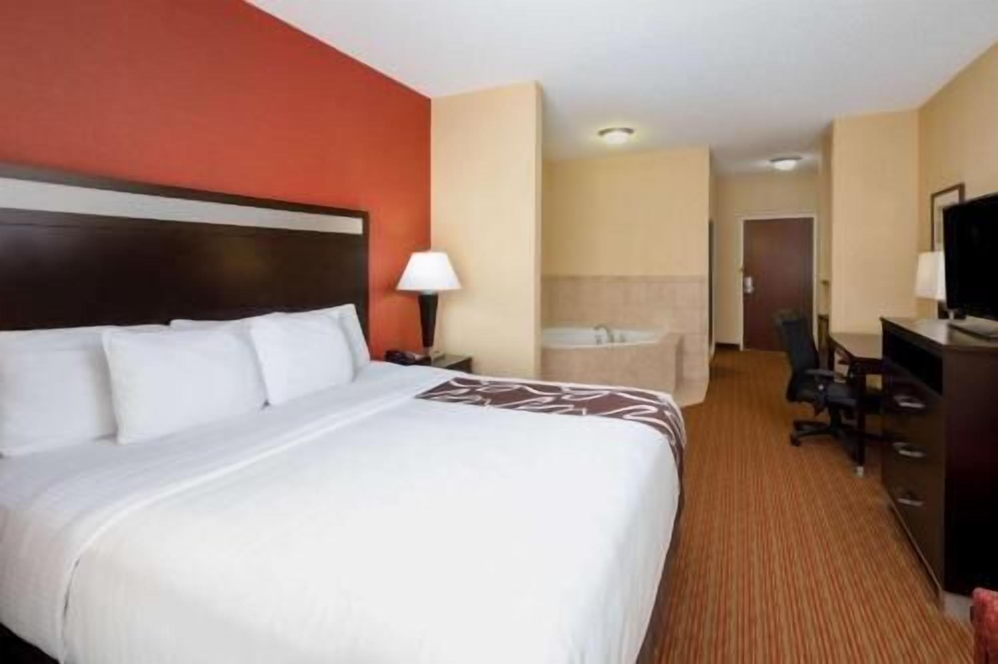 Premium bedding, desk, laptop workspace, iron/ironing board