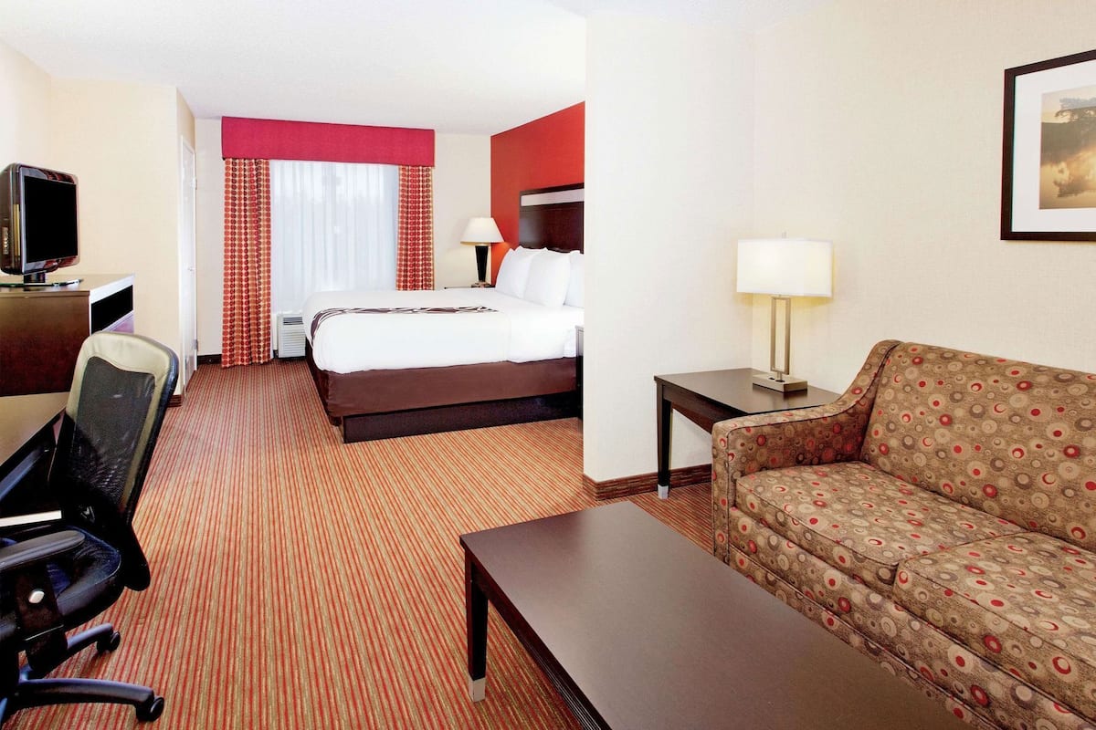 Premium bedding, desk, laptop workspace, iron/ironing board