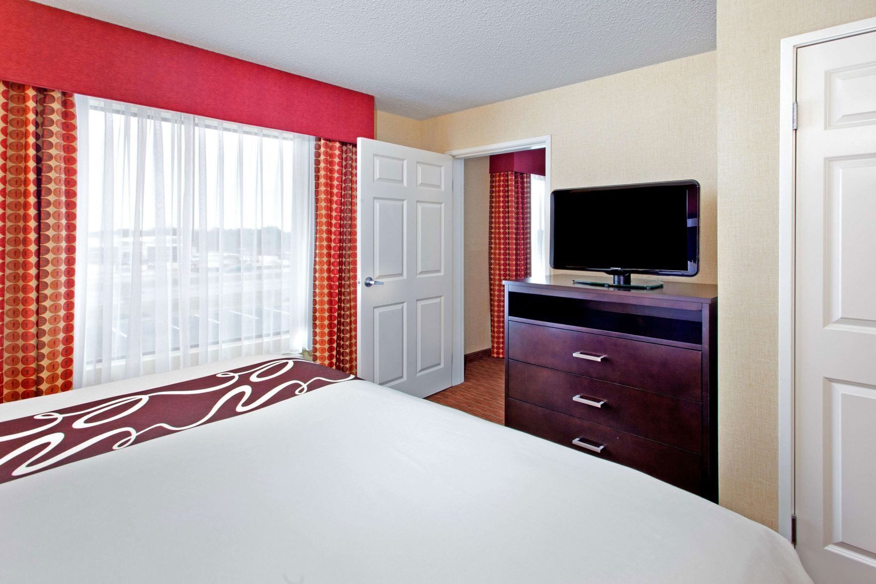 Premium bedding, desk, laptop workspace, iron/ironing board