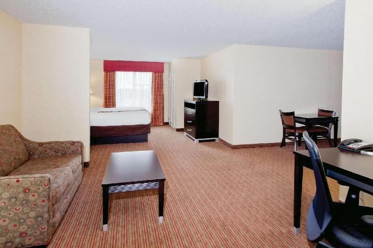 Premium bedding, desk, laptop workspace, iron/ironing board