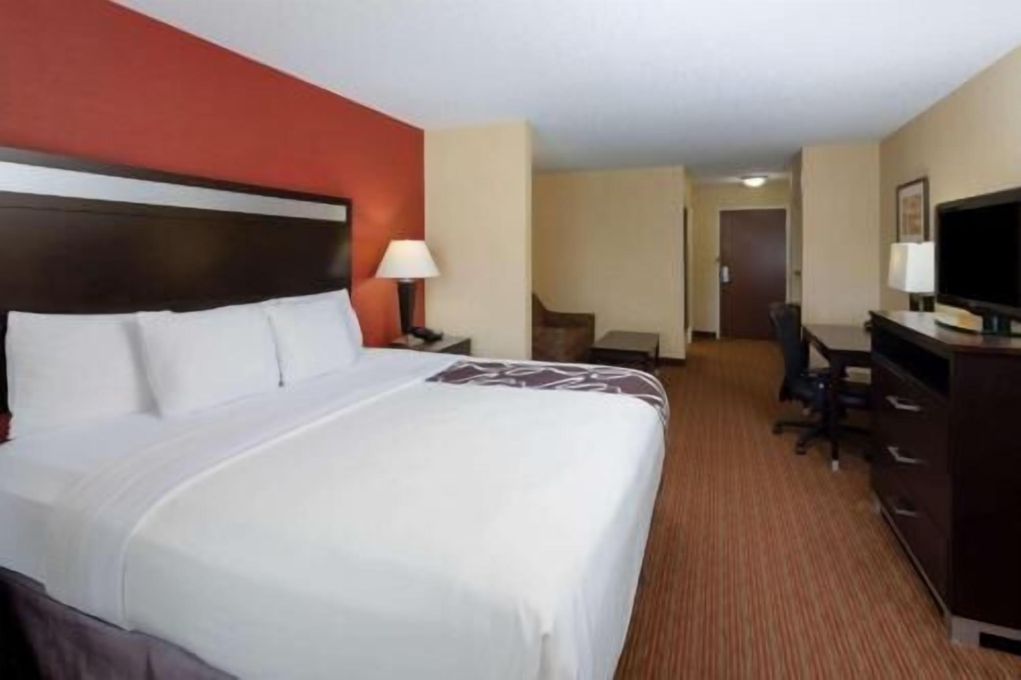 Premium bedding, desk, laptop workspace, iron/ironing board