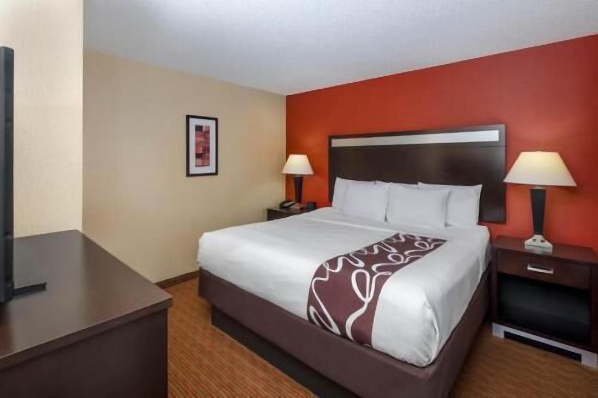 Premium bedding, desk, laptop workspace, iron/ironing board