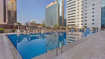 Outdoor pool, pool umbrellas, sun loungers
