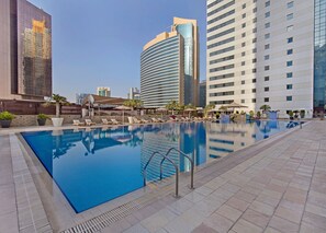 Outdoor pool, pool umbrellas, sun loungers