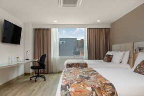 Premium bedding, down duvets, minibar, in-room safe - Novelty Suites Hotel - Oviedo Mall (Medellín)
